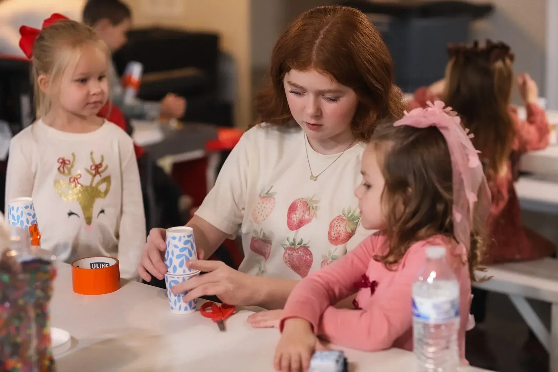 A Good News Co. volunteer caring for children.