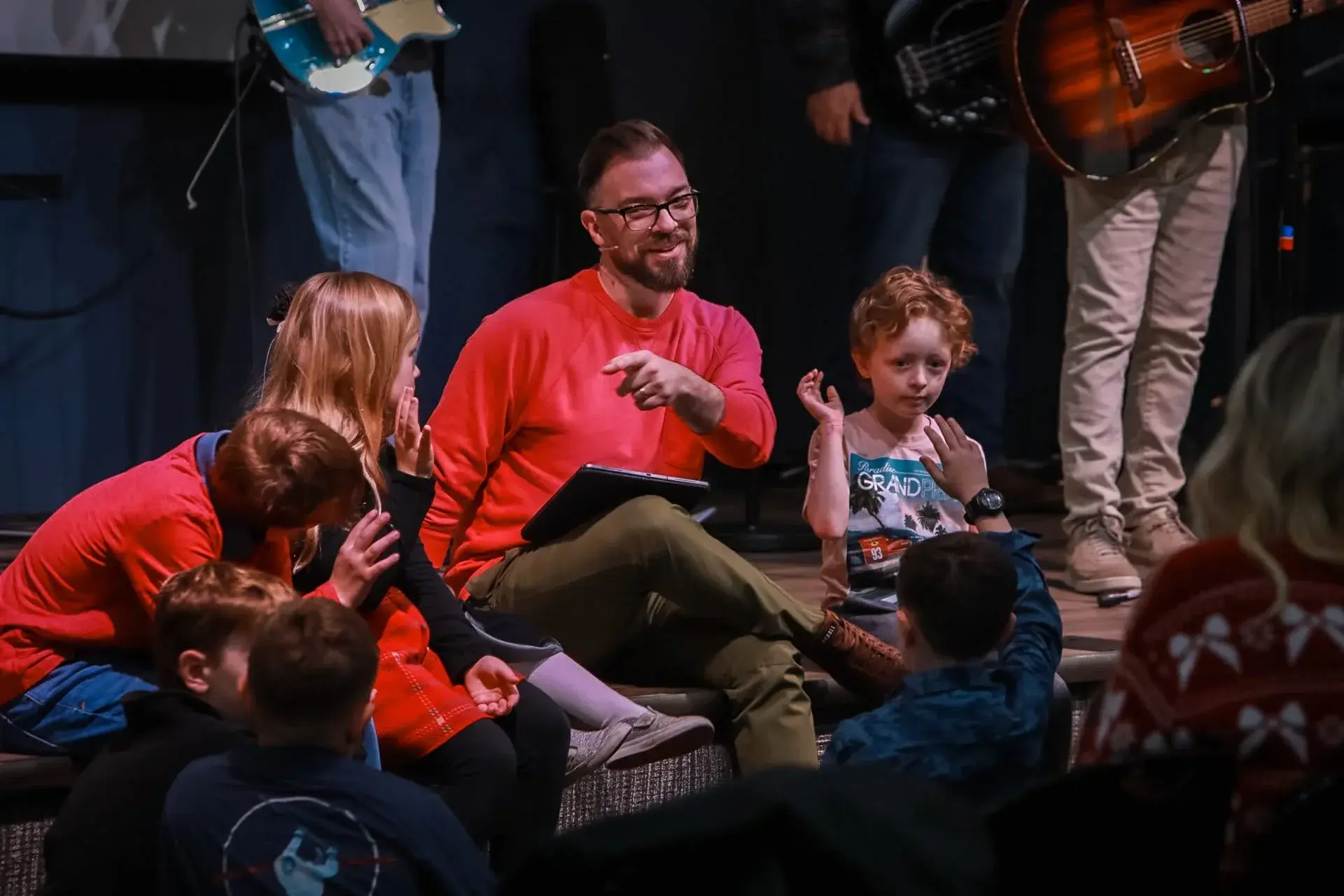 A child participating in worship at Good News Co.
