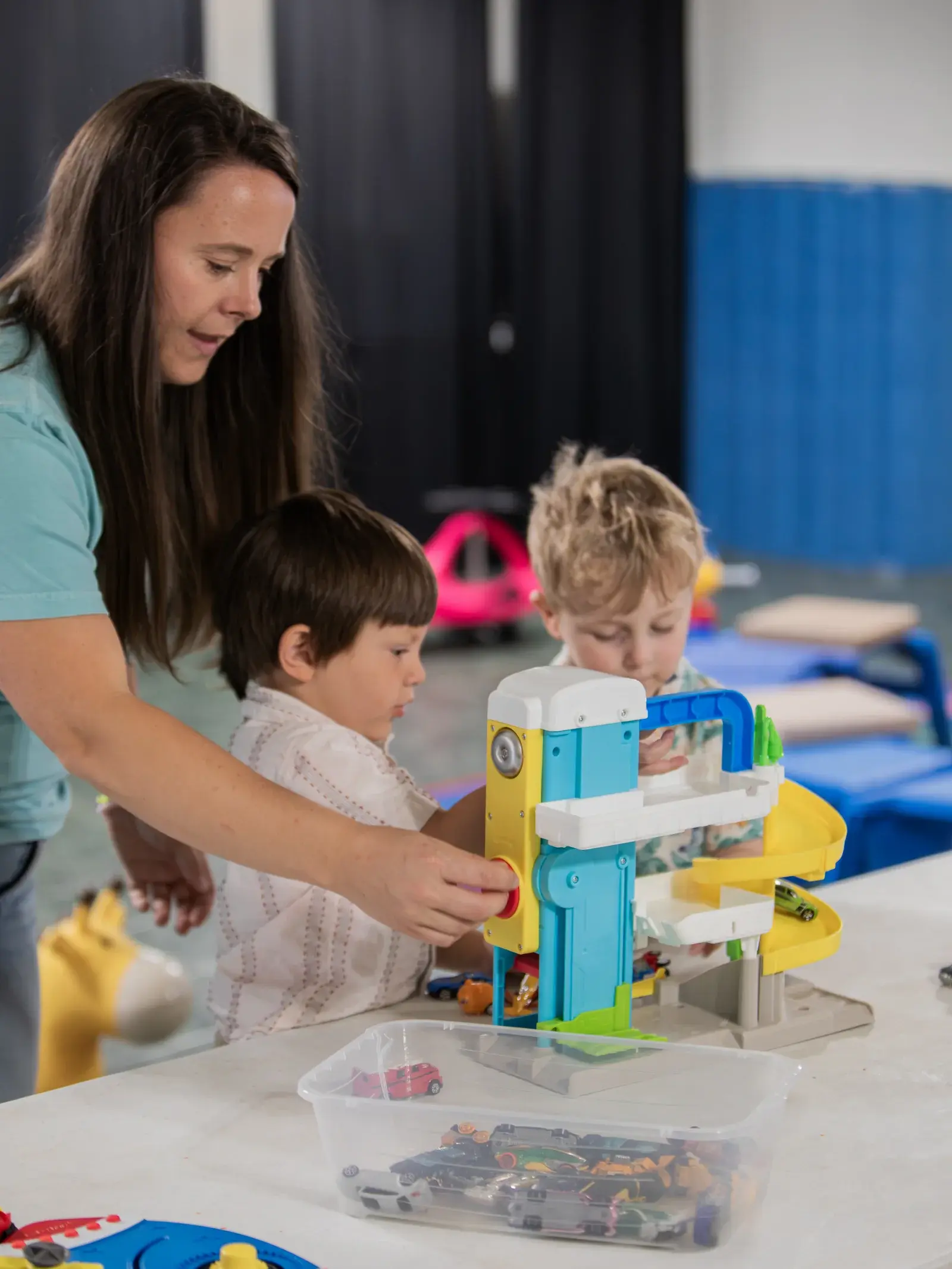 A Good News Co. volunteer serving children in the kids area.