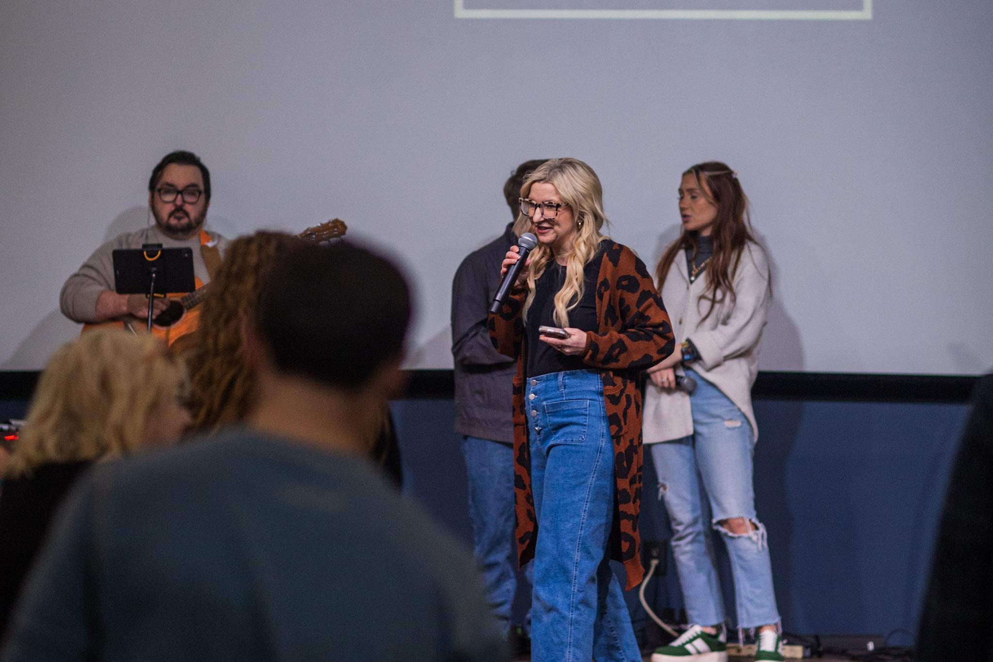 A Good News Co. leader speaking during a worship gathering.