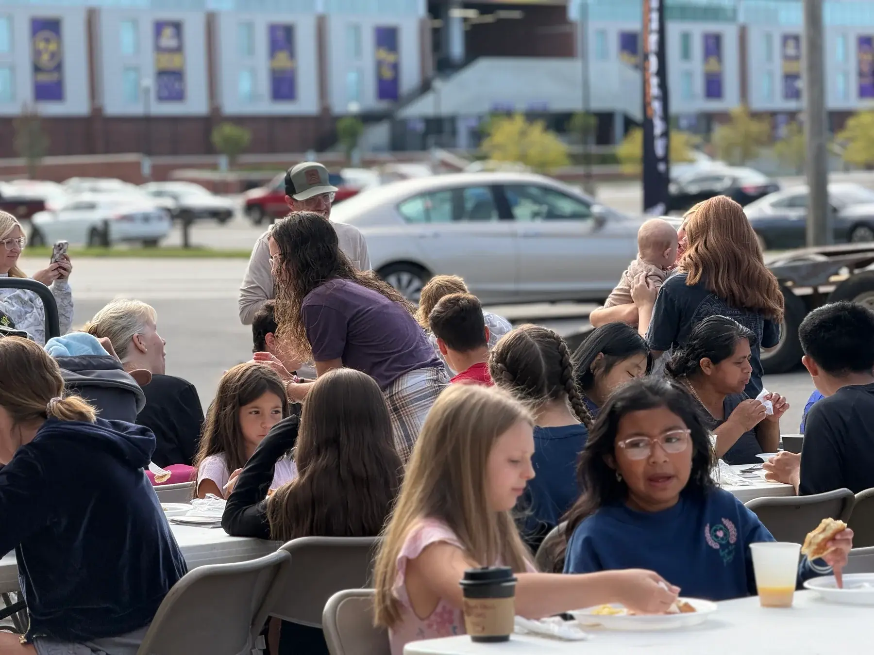 Families and neighbors enjoying breakfast together at The Good Table.