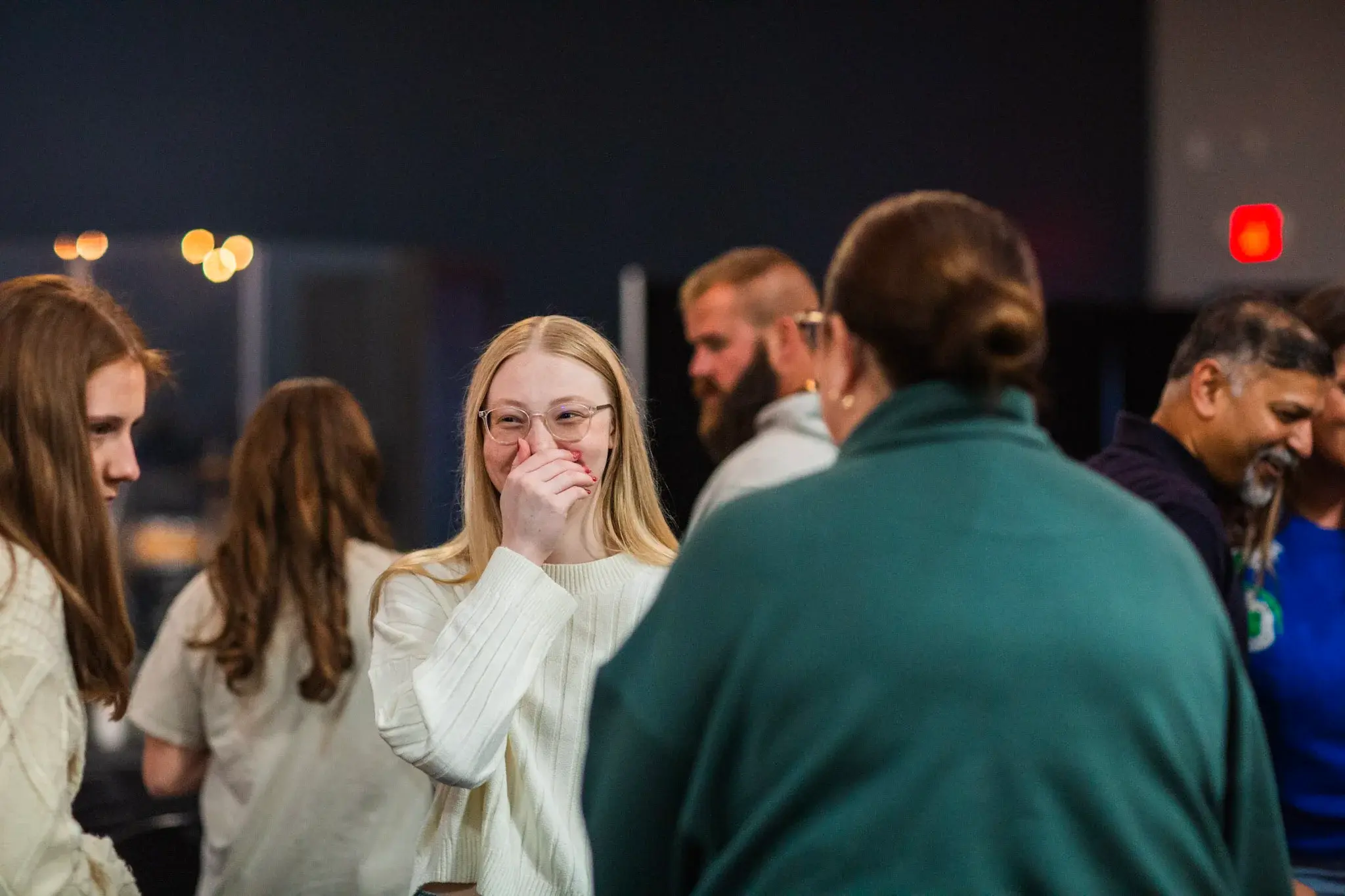 Students and adults building relationships at Good News Co.