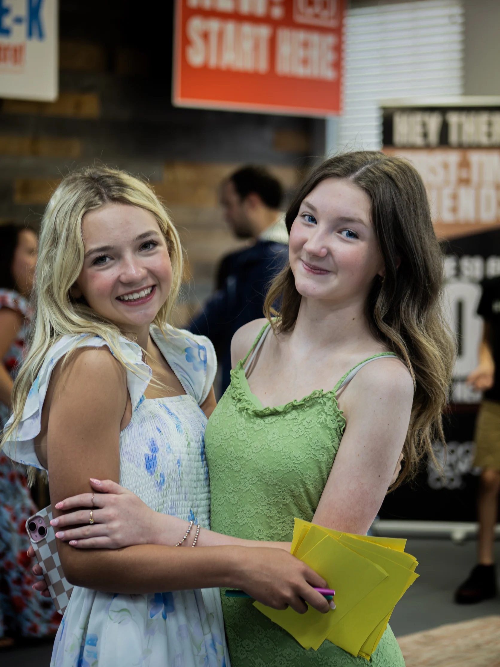 Two young women smiling together at church